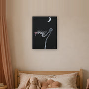 At least I tried canvas print by Artis Berkmanis, a white kitten reaching for a crescent moon on a black background. Shown at 46 x 61 cm in a Scandinavian children's room.