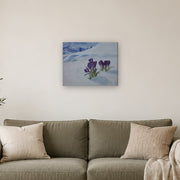 No one said it's not allowed canvas print by Artis Berkmanis, purple crocuses pushing up through white snow. Shown at 50 x 40 cm above a sofa in a Scandinavian living room.