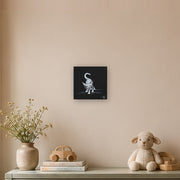 I am not as small as I look canvas print by Artis Berkmanis, a small white kitten stepping out of a black background. Shown at 30 x 30 cm in a Scandinavian children's room.