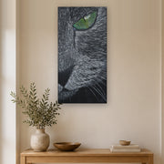 I saw you first canvas print by Artis Berkmanis, a grey cat's green eye watching from the dark. Shown at 41 x 81 cm in a Scandinavian hallway.