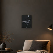 At least I tried canvas print by Artis Berkmanis, a white kitten reaching for a crescent moon on a black background. Shown at 30 x 41 cm on a dark wall in a cosy living room.