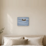 I am not lost, only hiding canvas print by Artis Berkmanis, fox ears rising from soft blue-white snow. Shown at 41 x 30 cm above a bed in a calm Scandinavian bedroom.
