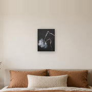 The night did not keep him canvas print by Artis Berkmanis, the white outline of a horse's head, its breath turning to mist on a black background. Shown at 30 x 41 cm above a bed in a calm Scandinavian bedroom.