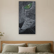 I saw you first canvas print by Artis Berkmanis, a grey cat's green eye watching from the dark. Shown at 51 x 102 cm above a bed in a calm Scandinavian bedroom.