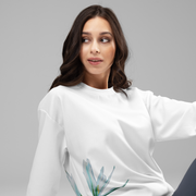 I am sweatshirt by Art-is-Artis worn by a smiling model sitting relaxed, close-up