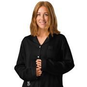 I am not as small as I look pyjama top by Art-is-Artis – black silky pyjama top with a small white kitten near the hem, worn by a model, close-up