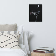 At least I tried canvas print by Artis Berkmanis on a white wall above an armchair with cushions and books