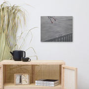 Oh crap! canvas print by Artis Berkmanis on a light wall above a wooden sideboard with dried grasses