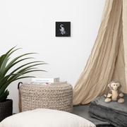 I am not as small as I look canvas print by Artis Berkmanis on a light wall above a wicker basket, beside a linen curtain and plants