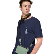 I am not as small as I look T-shirt by Art-is-Artis – man wearing the navy T-shirt, side view of the small white kitten on the chest