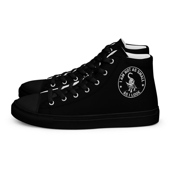 Black men’s high-top sneakers with the “I am not as small as I look” kitten badge by Artis Berkmanis — side view with the kitten badge